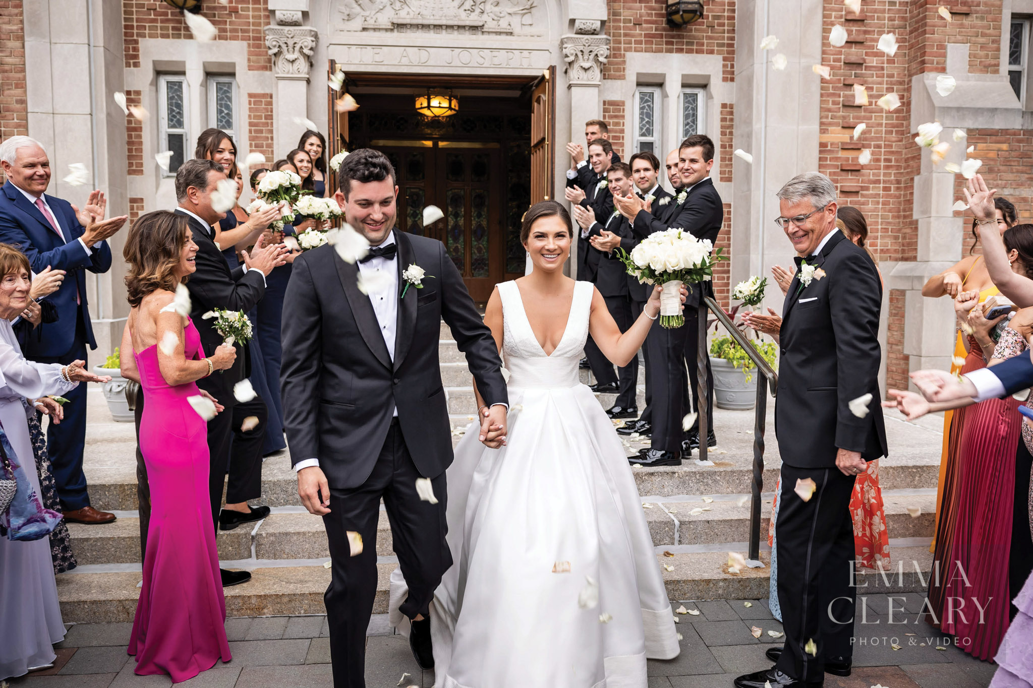 Happy wedding couple leaving the church