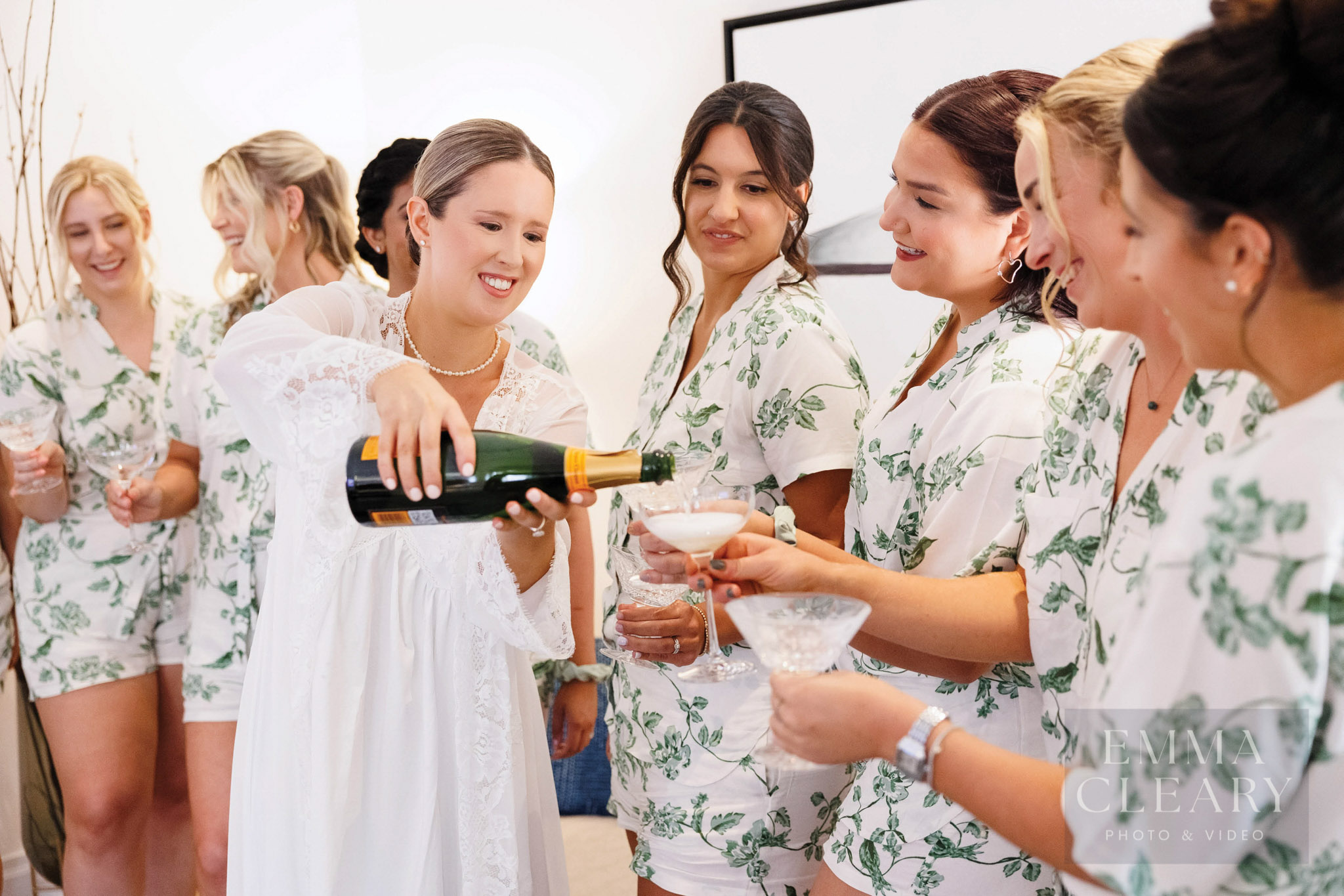 The bridesmaids drinking champagne