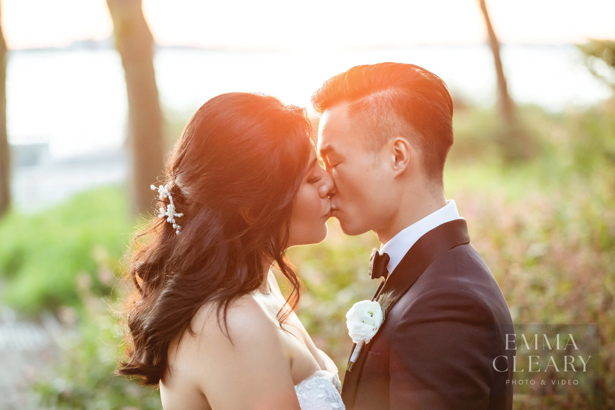 Sunset wedding kiss