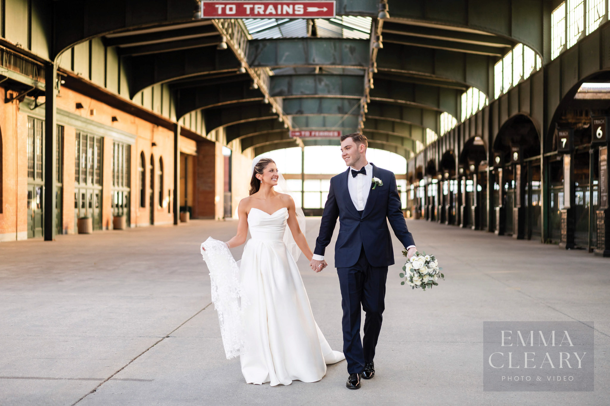 Bride and groom walking at the station