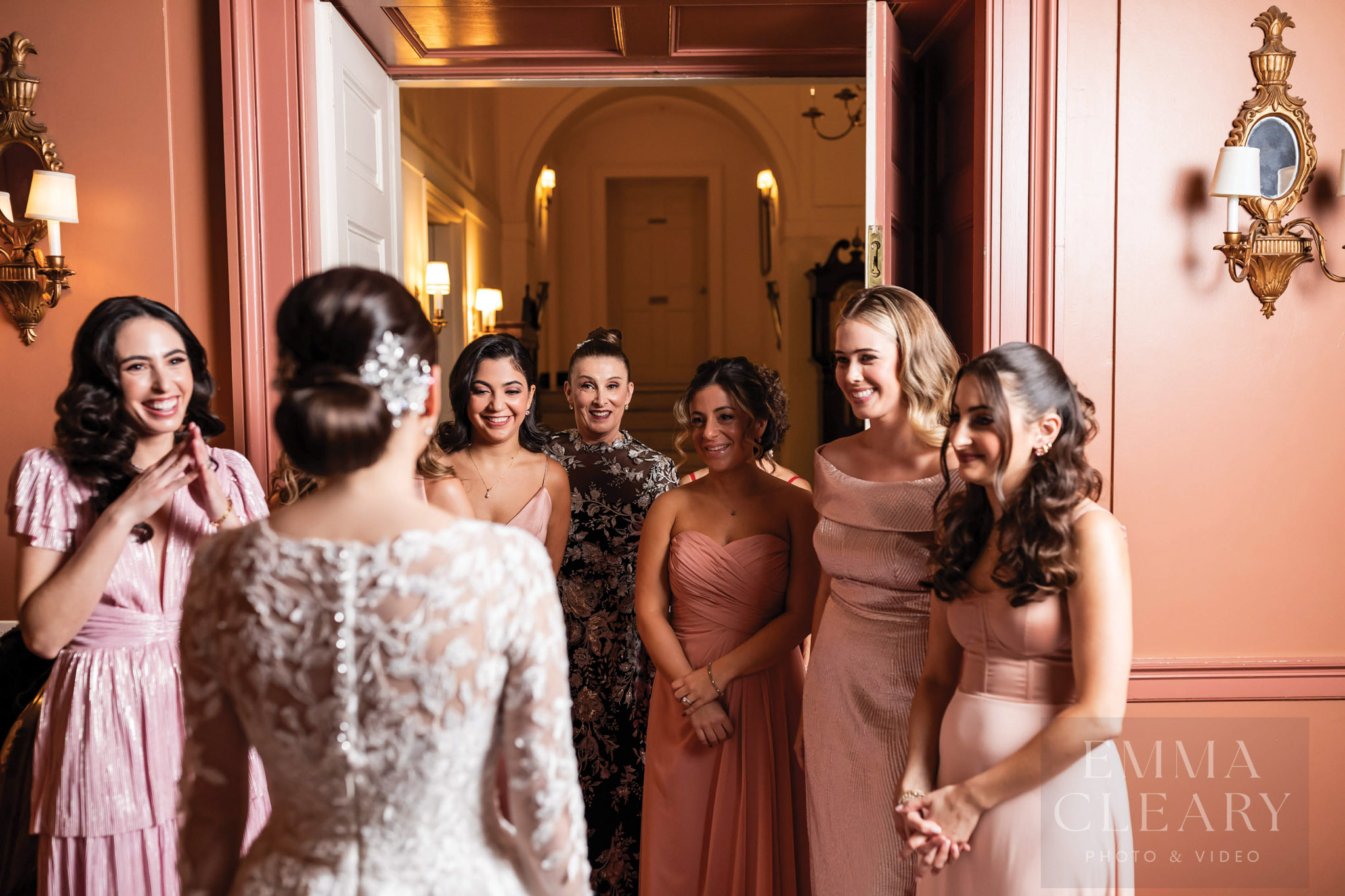 Bridesmades are surprised by the bride