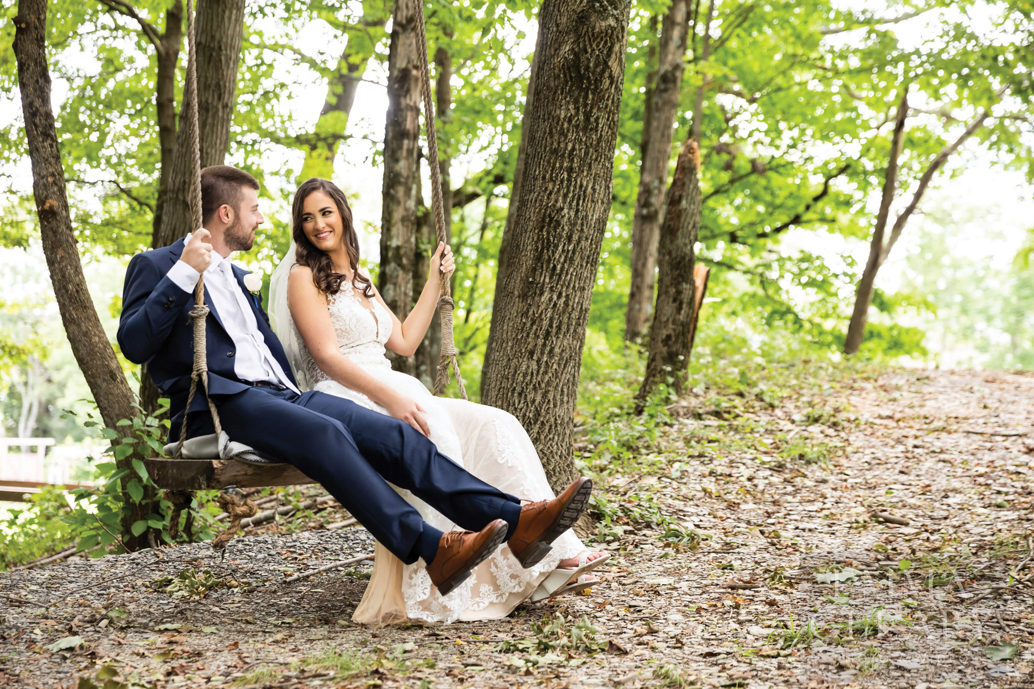 The bride and groom on a swing