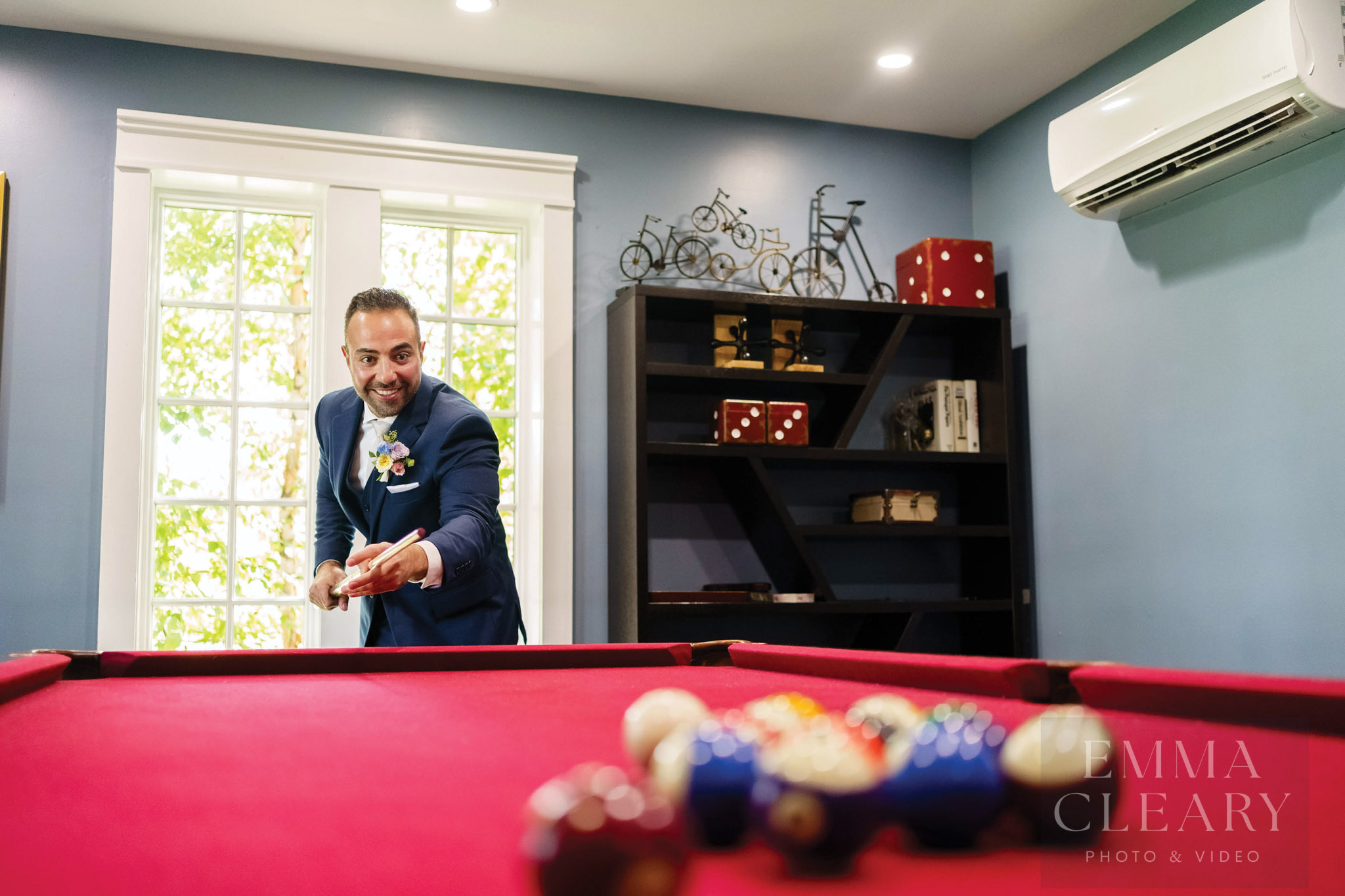 The groom is playing billiards