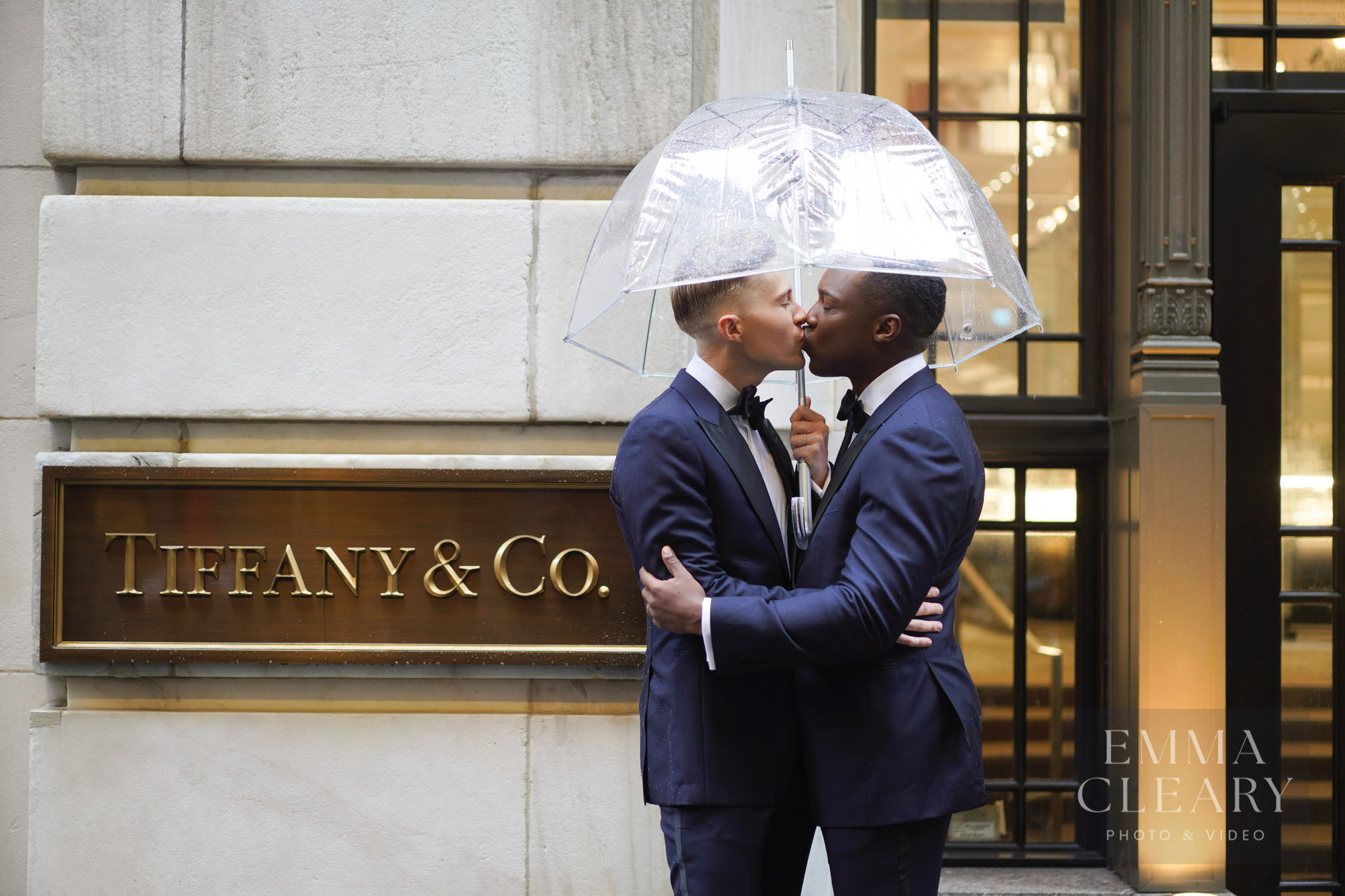 Wedding kiss under the umbrella near the Tiffany & Co. in Manhattan