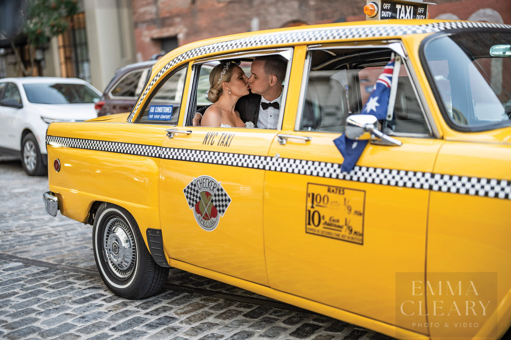 Wedding portrait of a couple in a taxi