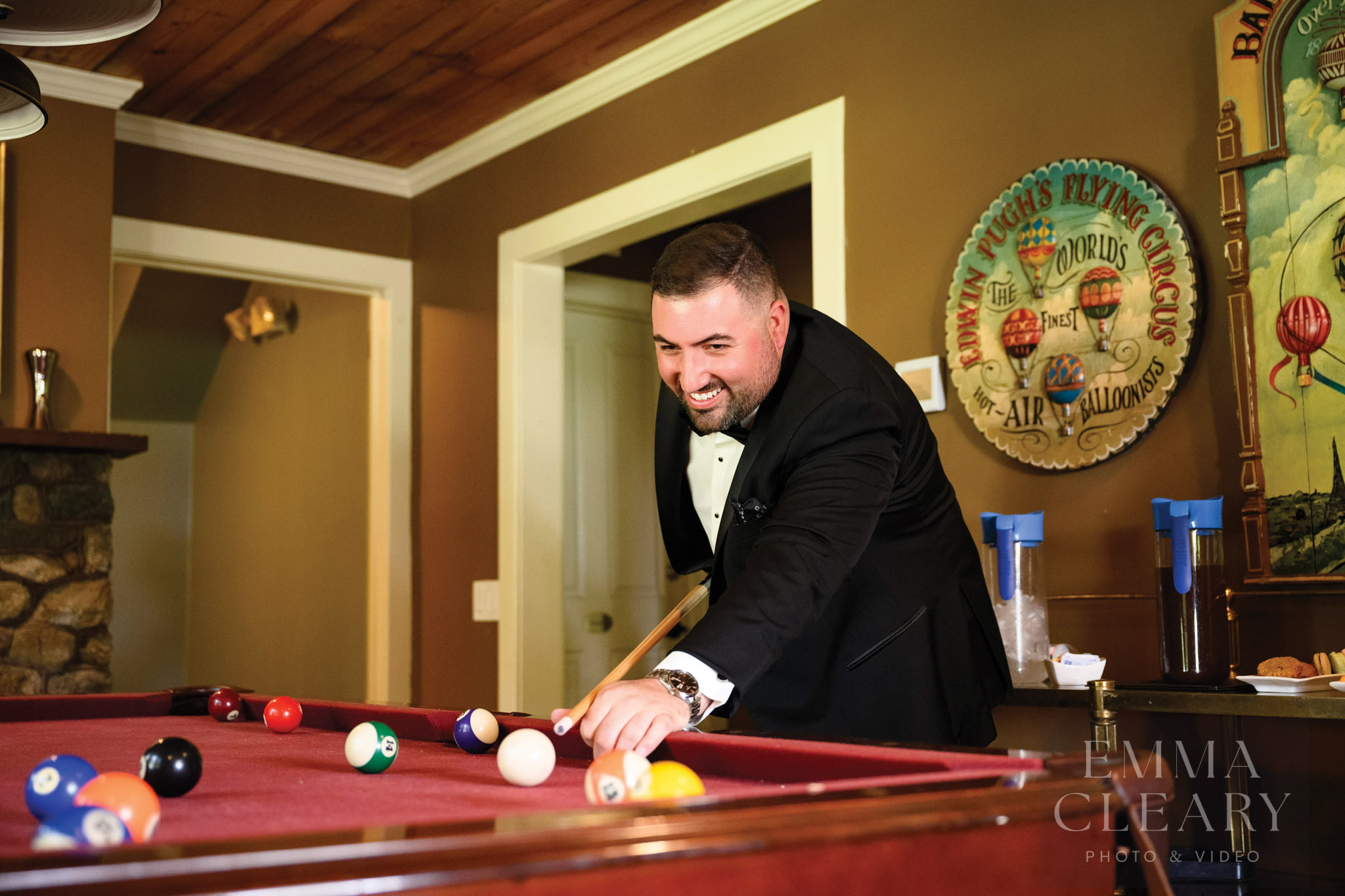 The groom is playing billiards