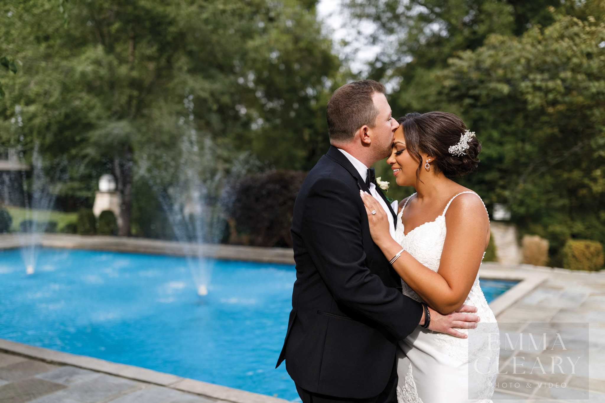 The groom kisses the bride