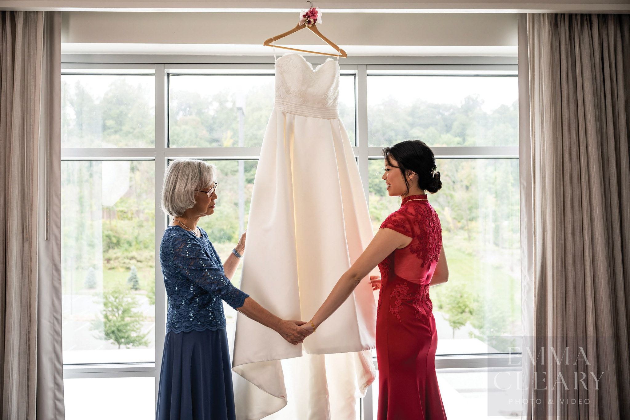 Bride and mother near the wedding dress