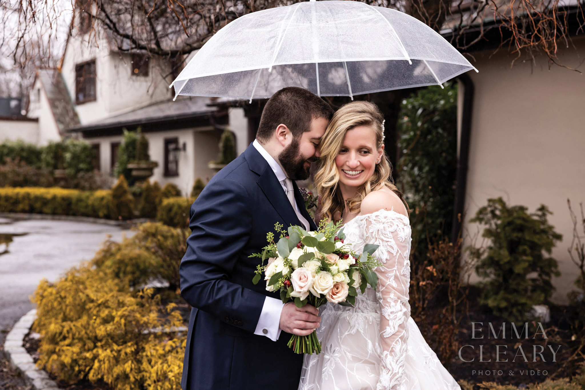 Wedding photo of a couple in the rain