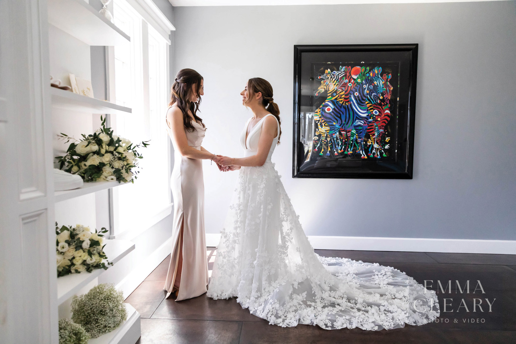 Bride and her sister staying near window