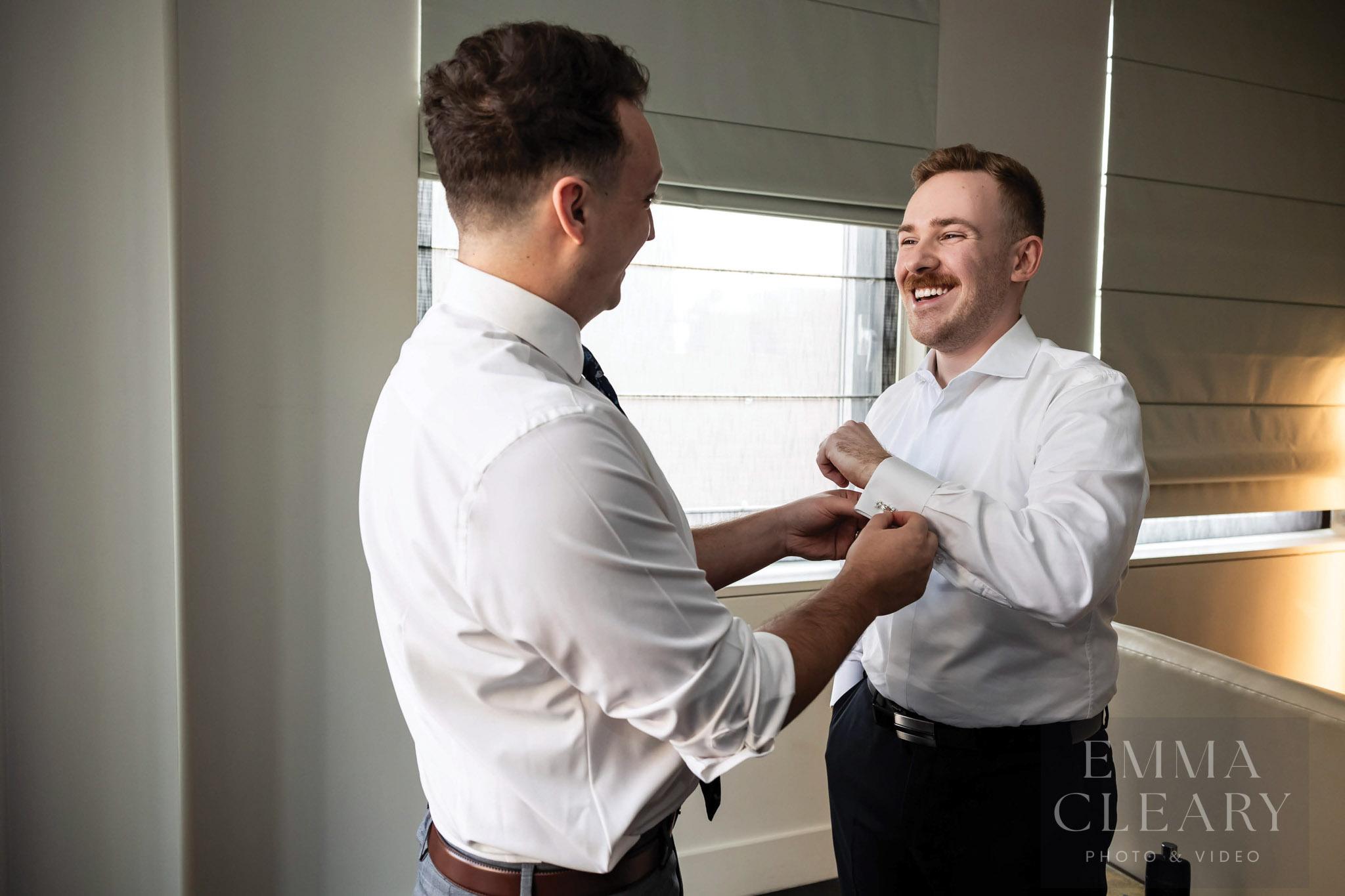 Best man helps the groom