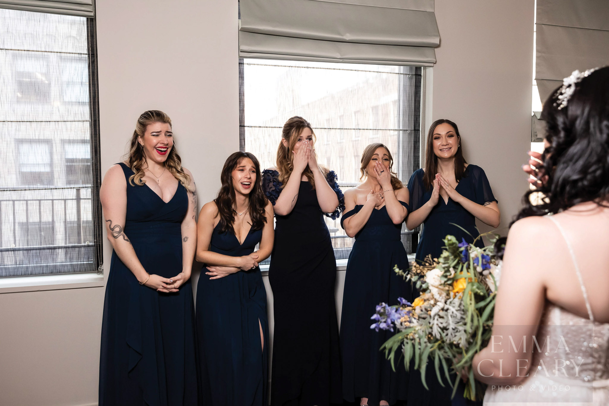 Bridesmades are surprised by the bride