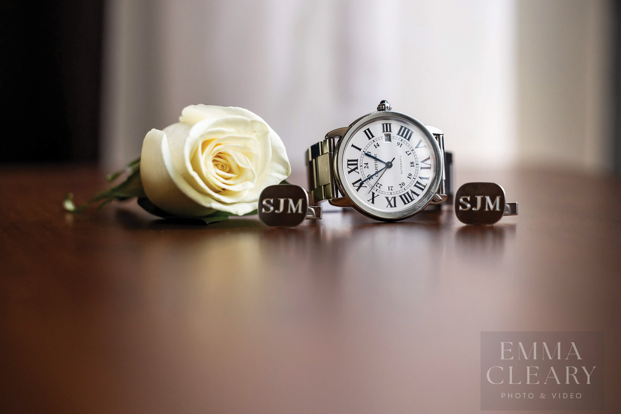 The groom's boutonniere, watch and cufflinks