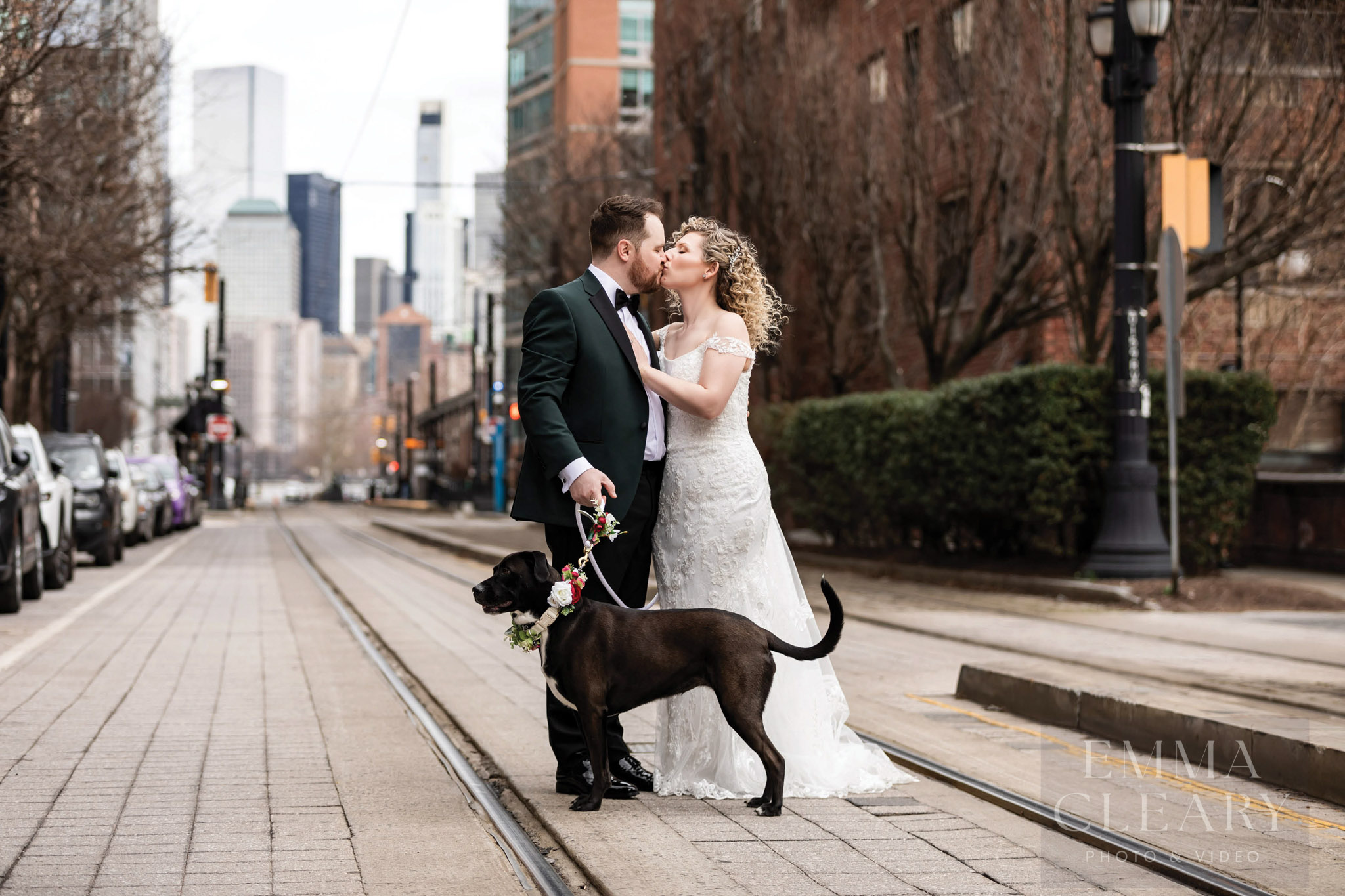 A wedding couple and their dog