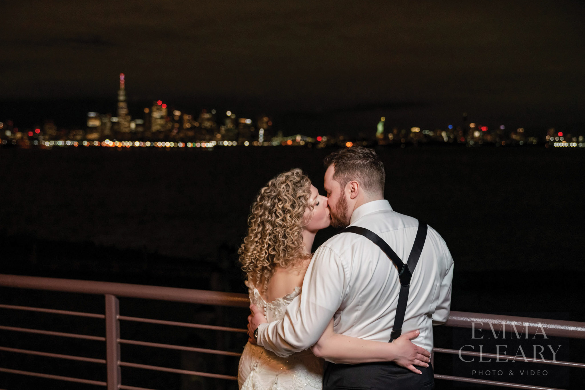 Wedding kiss on the background of the night city