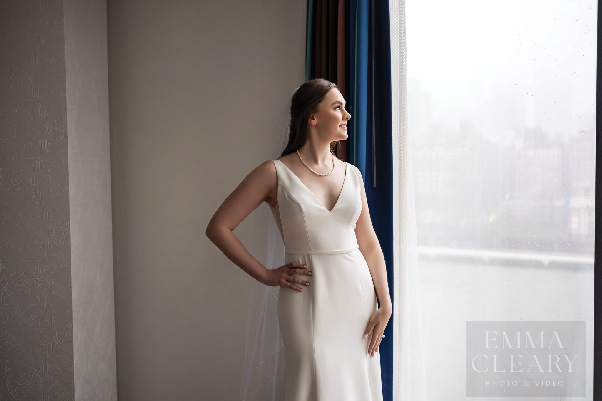 Portrait of the bride at the window