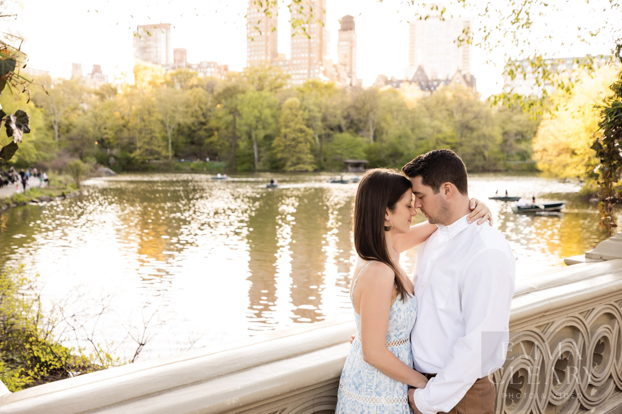 Photo of a couple on the background of a lake