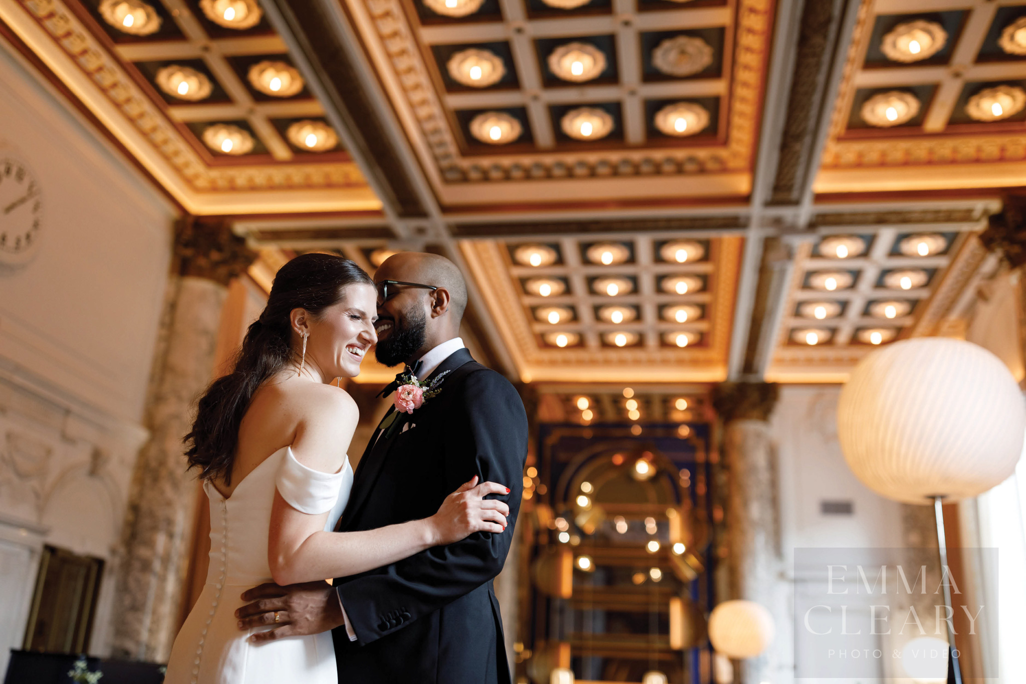 The bride and groom are laughing
