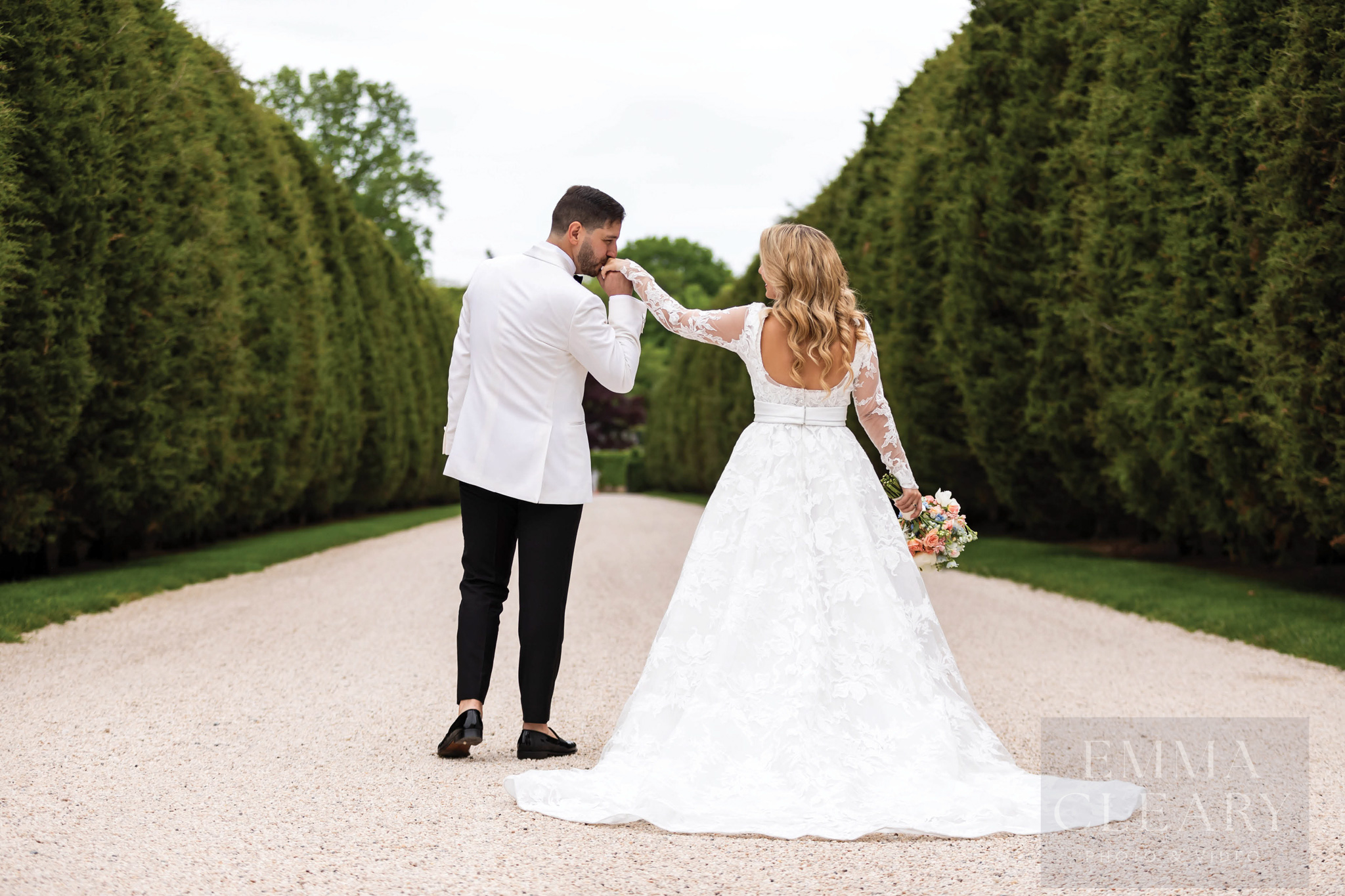 The groom kisses the bride's hand