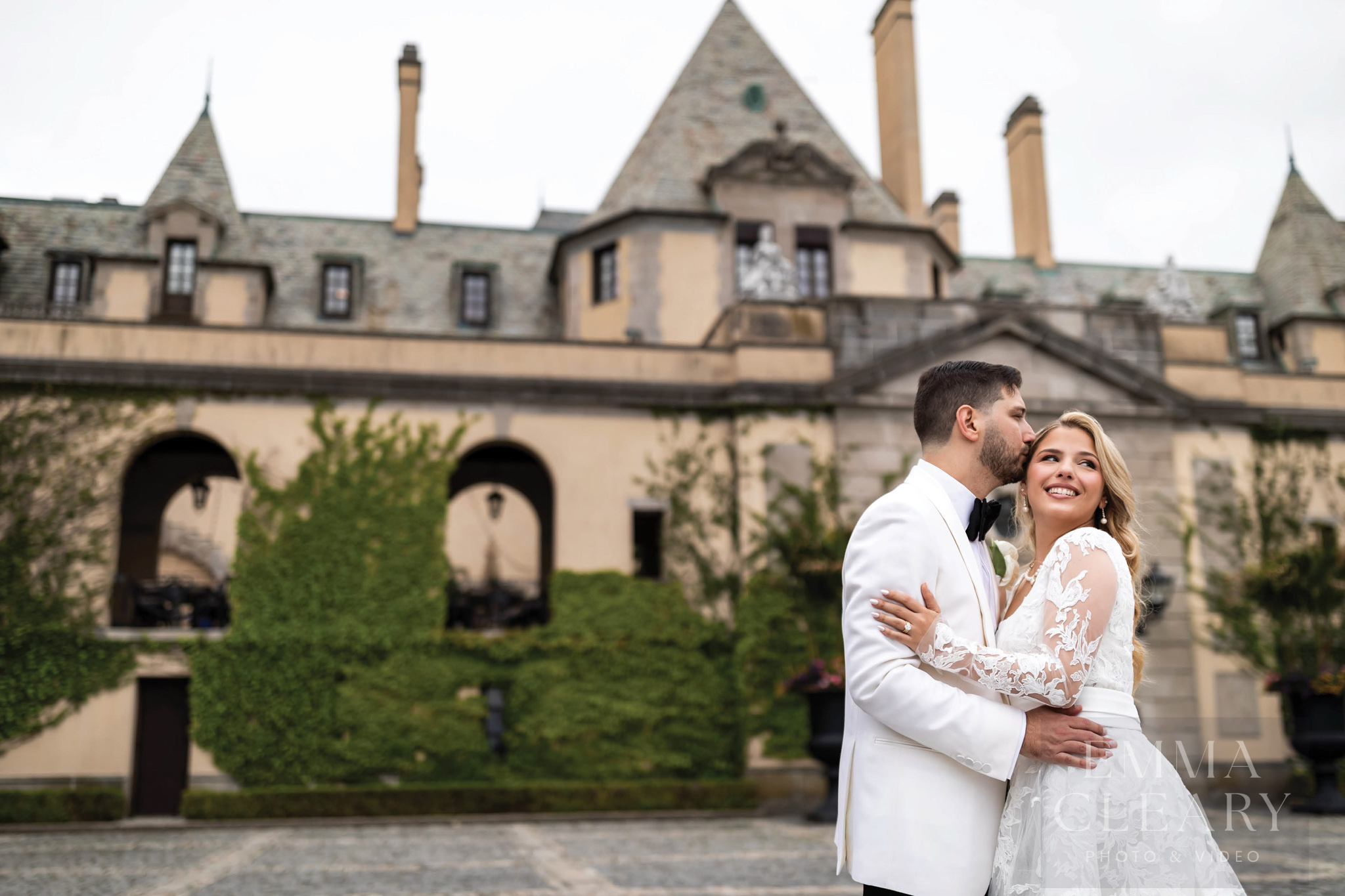 The groom kisses the bride