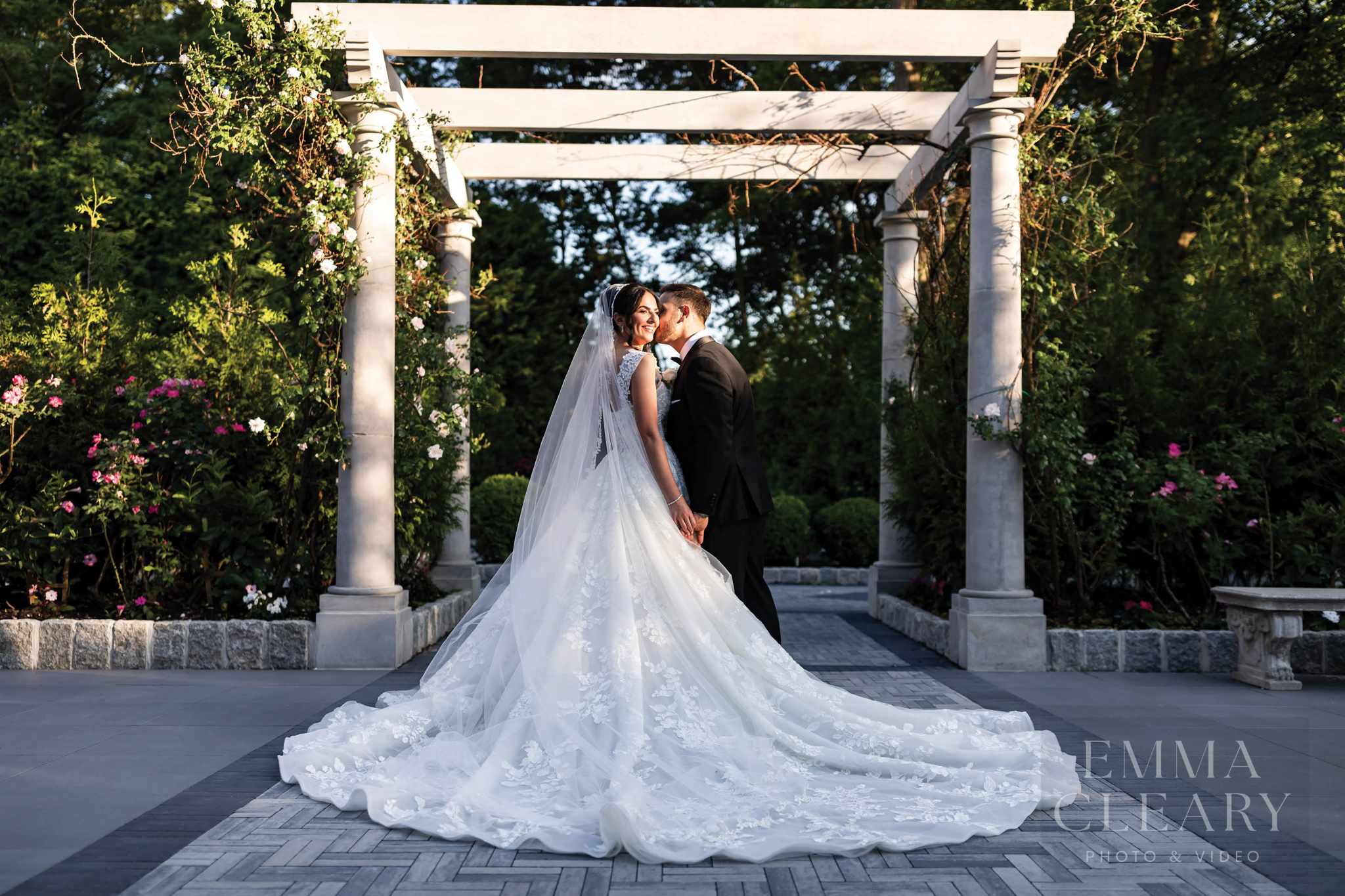 The groom kisses the bride