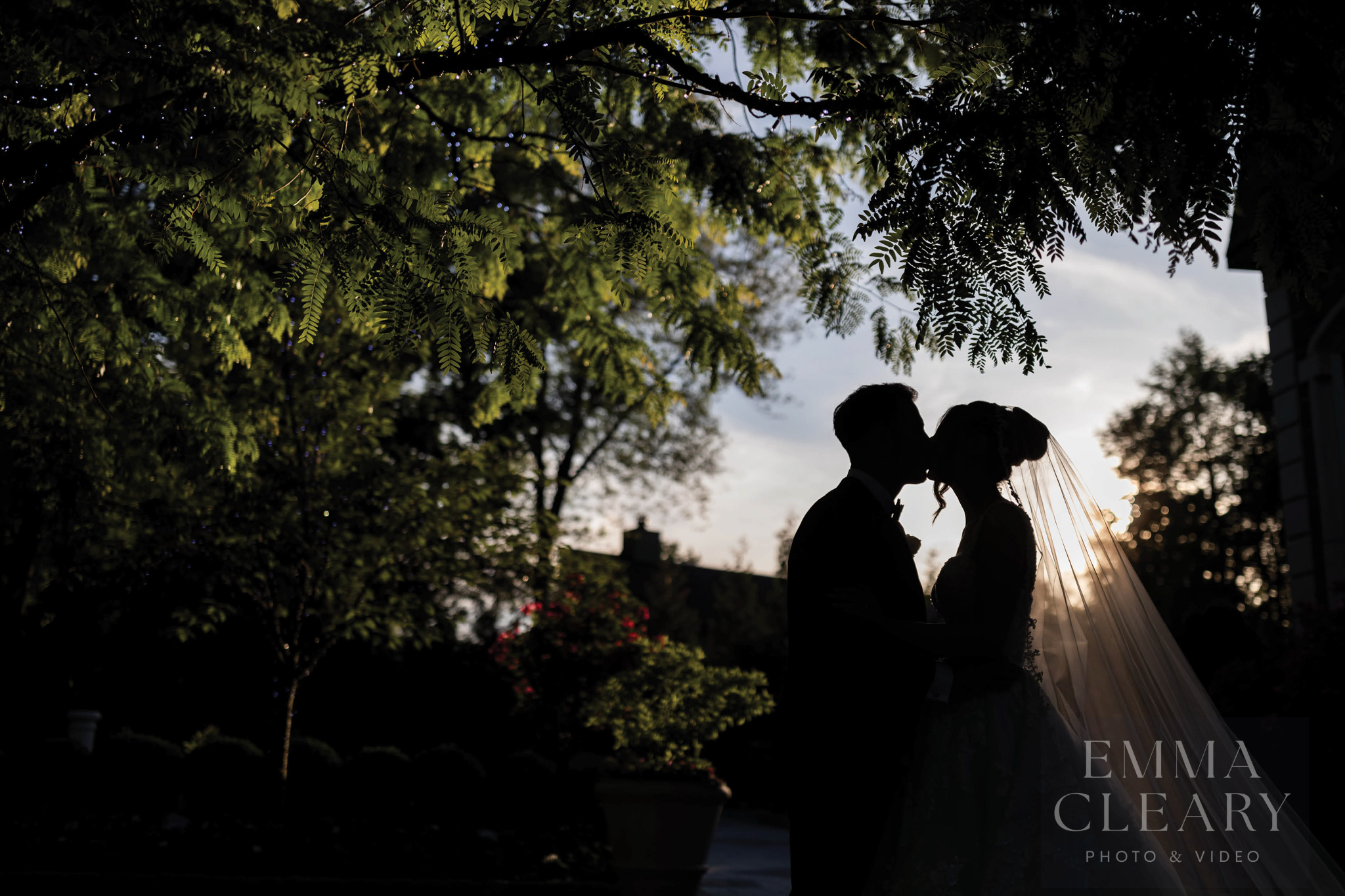 Sunset wedding kiss