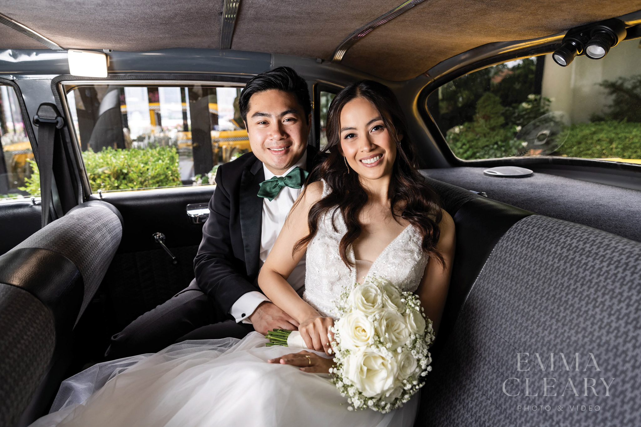 Portrait of a couple in a yellow taxi