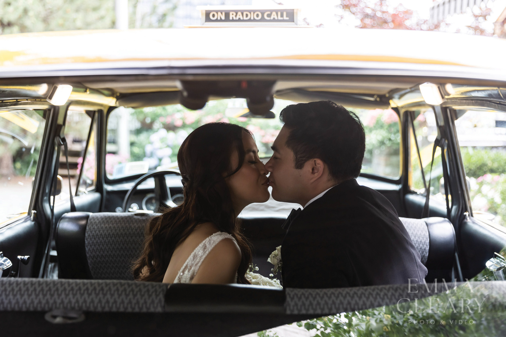 A couple's kiss in a retro taxi