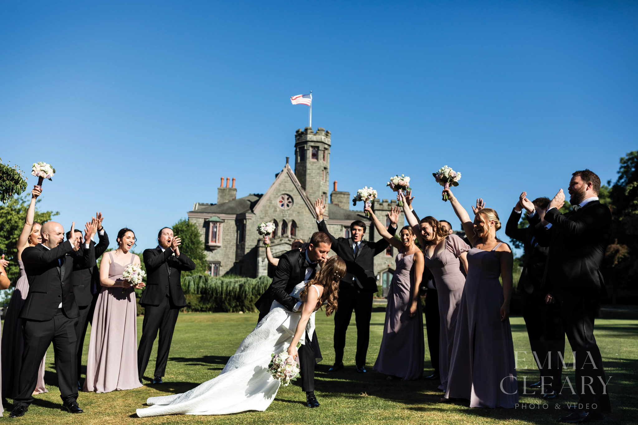 Group wedding portrait with a kiss