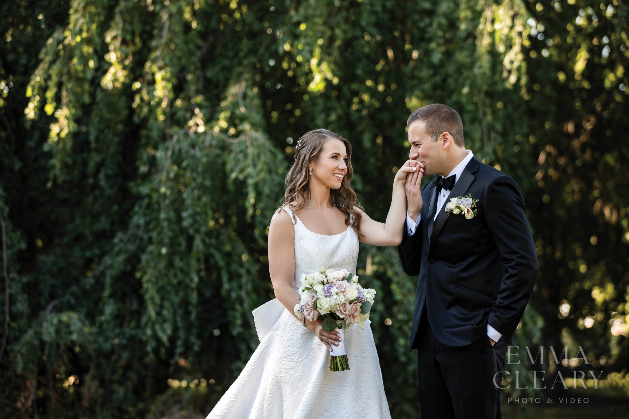 The groom kisses the bride