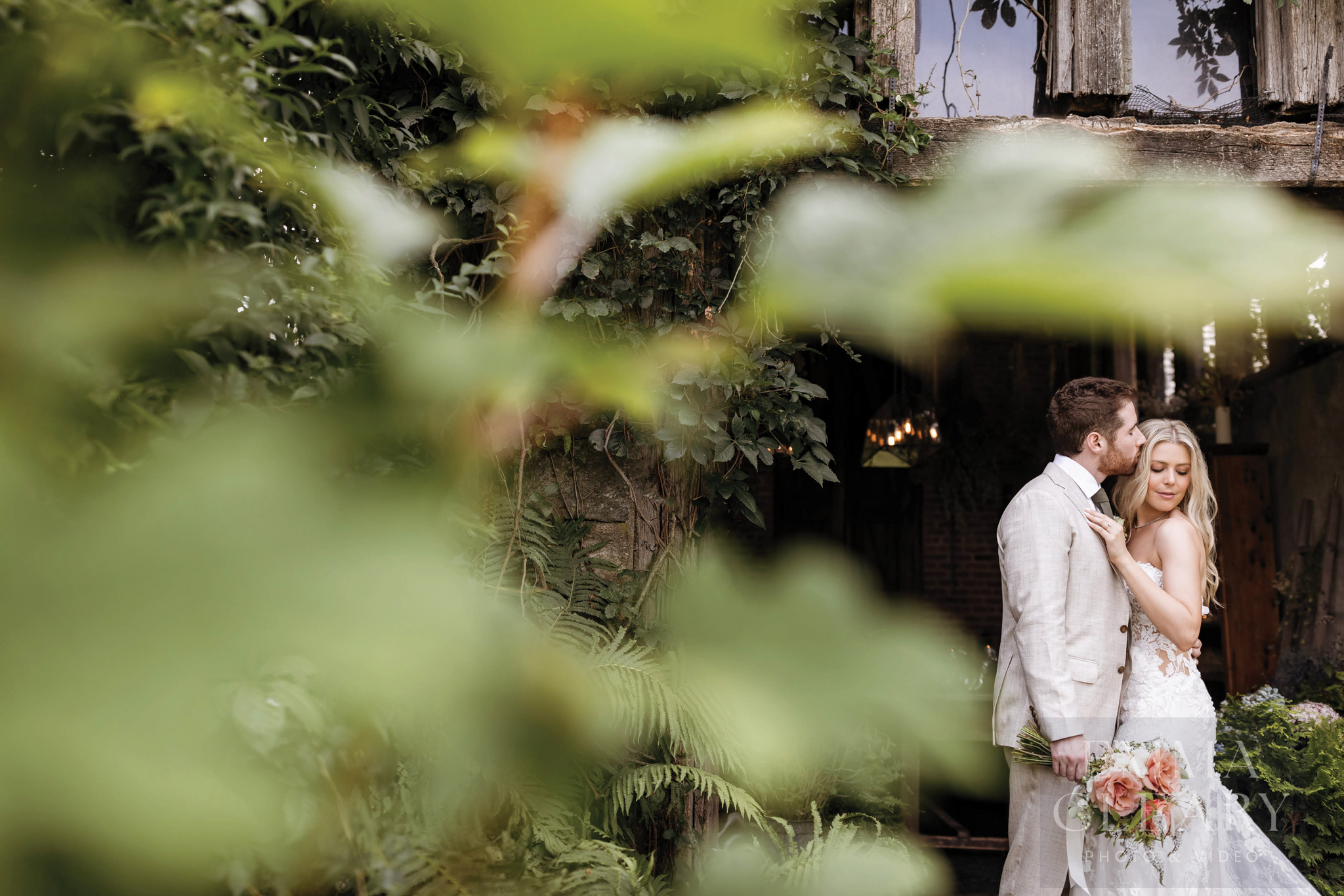 The groom kisses the bride
