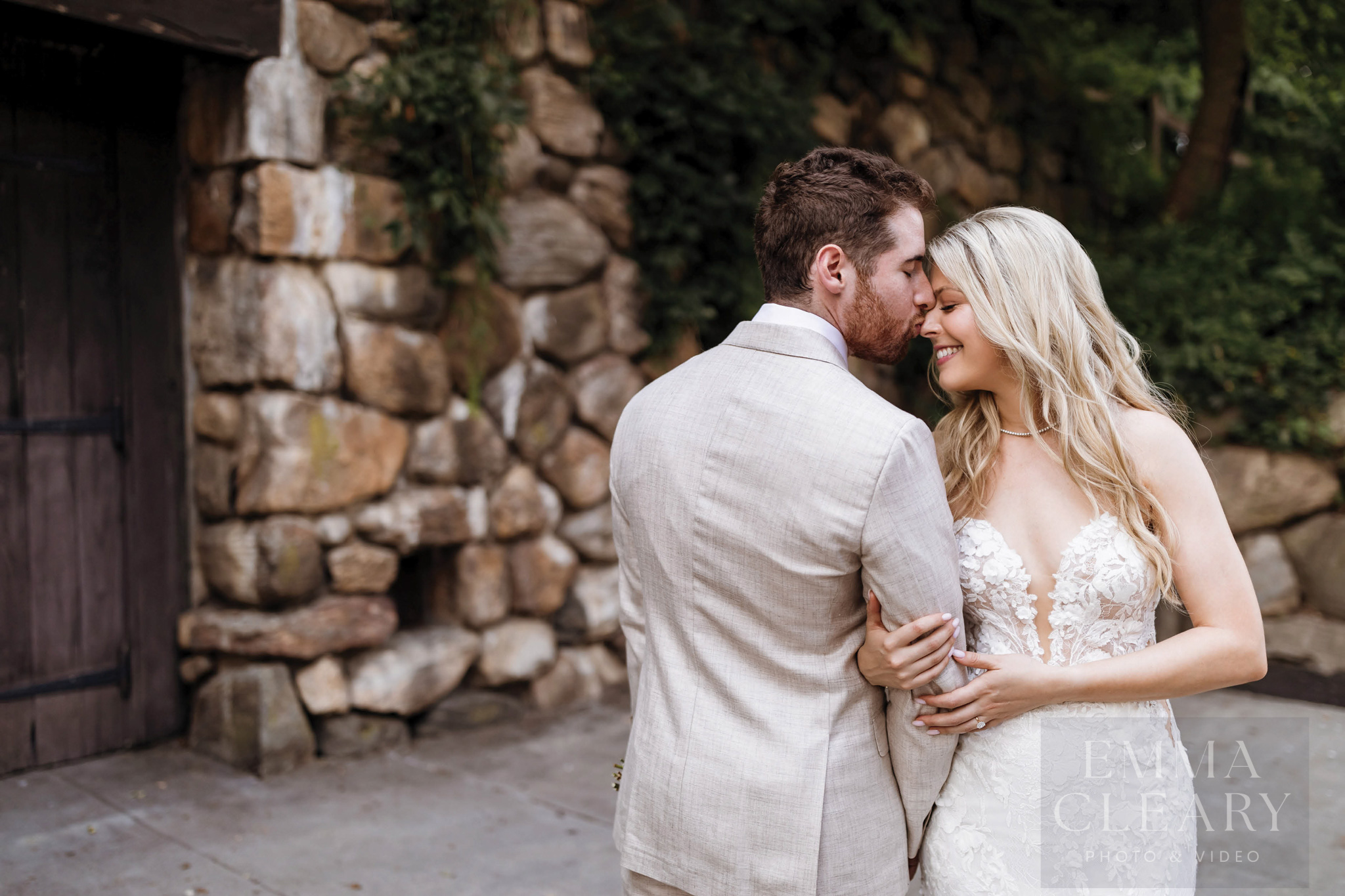 The groom kisses the bride