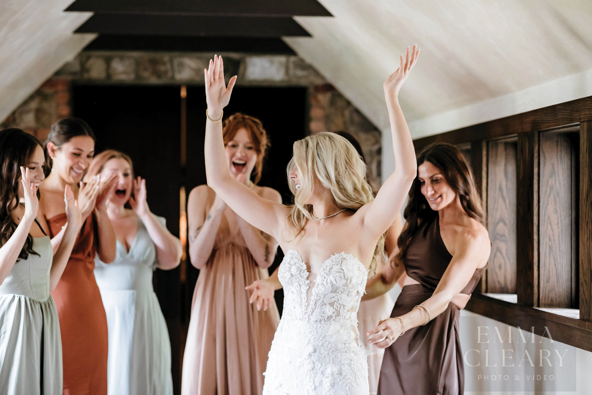 Bridesmades are surprised by the bride