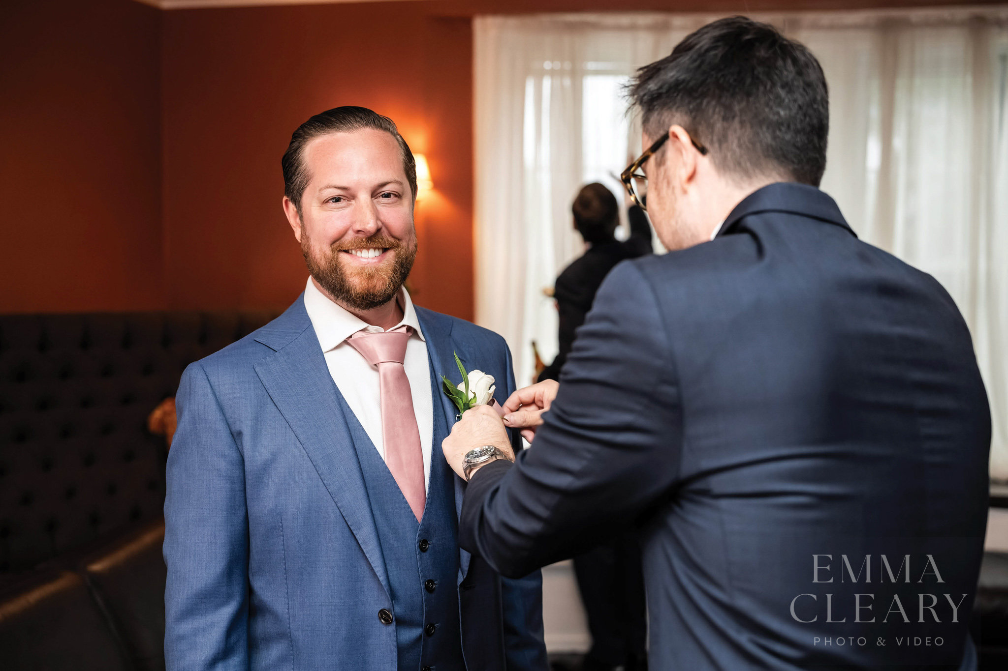The best friend helps the groom