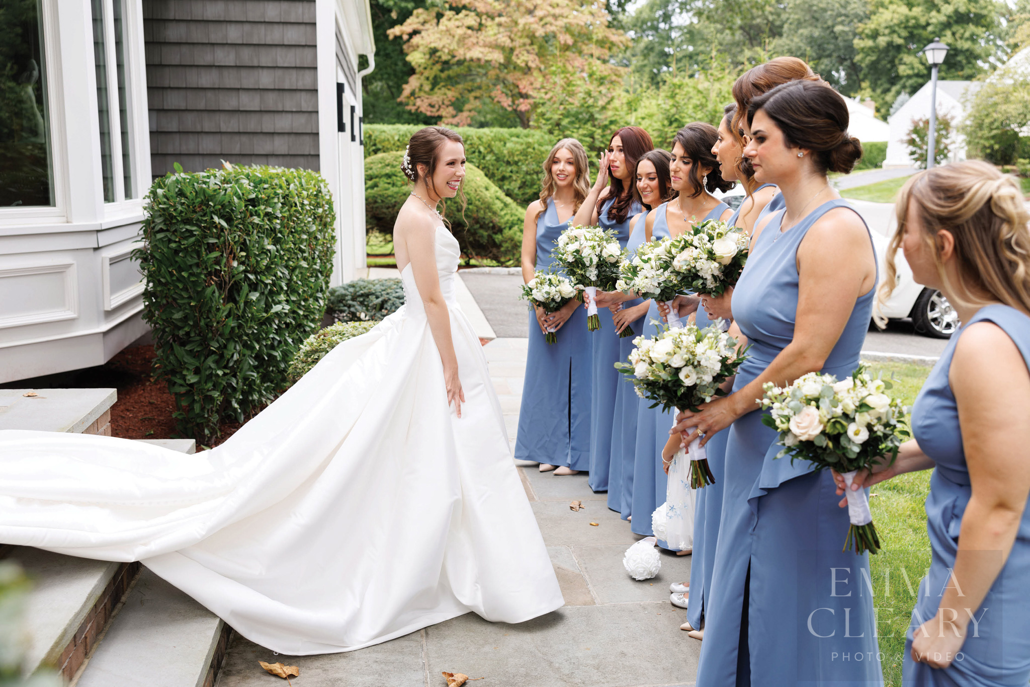 Bridesmades are surprised by the bride