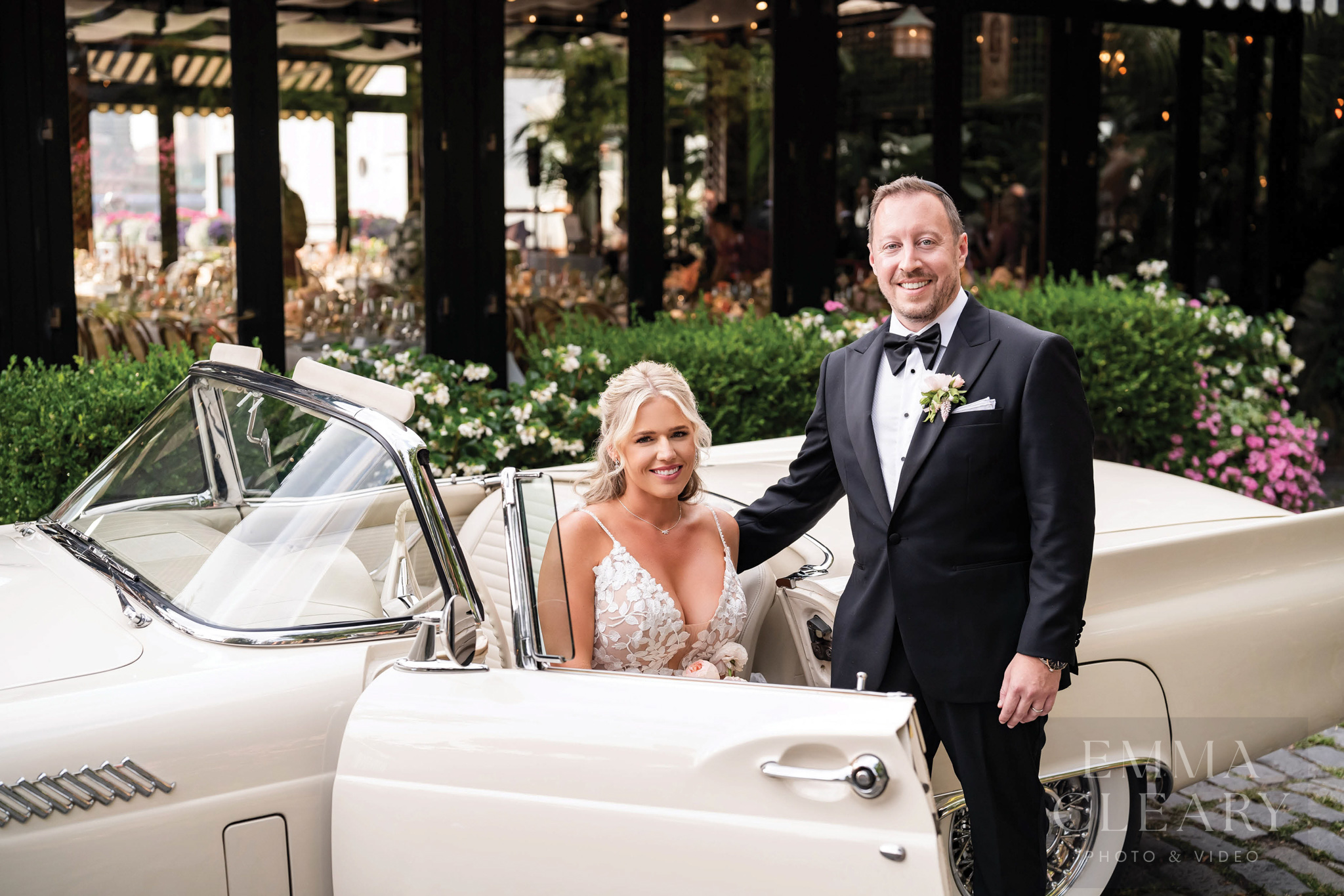 Portrait of a couple in a wedding car