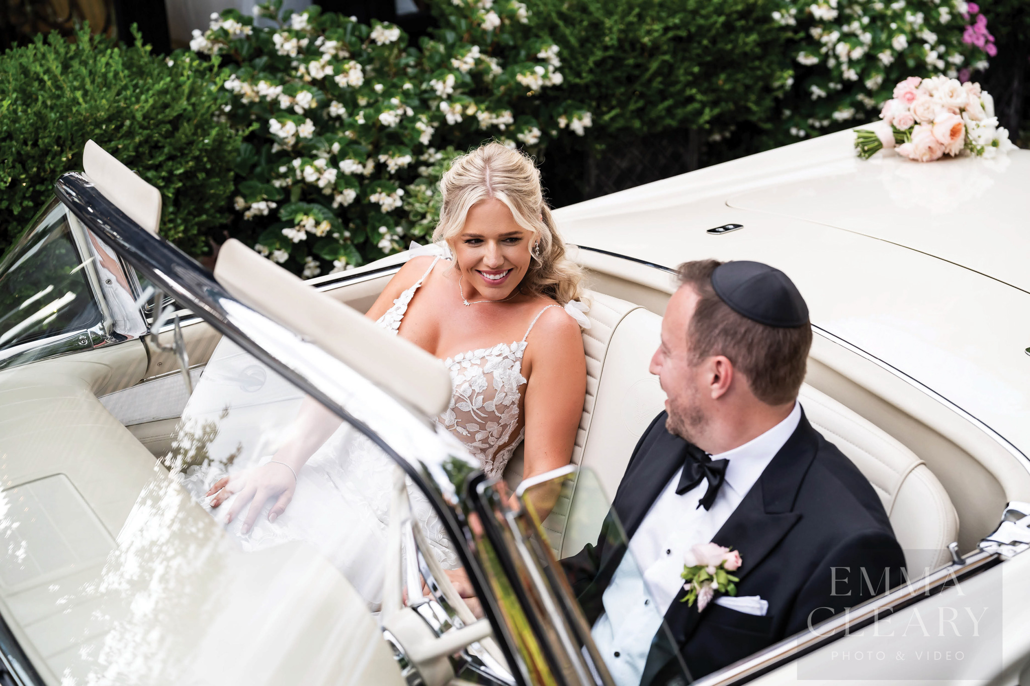 Portrait of a couple in a wedding car