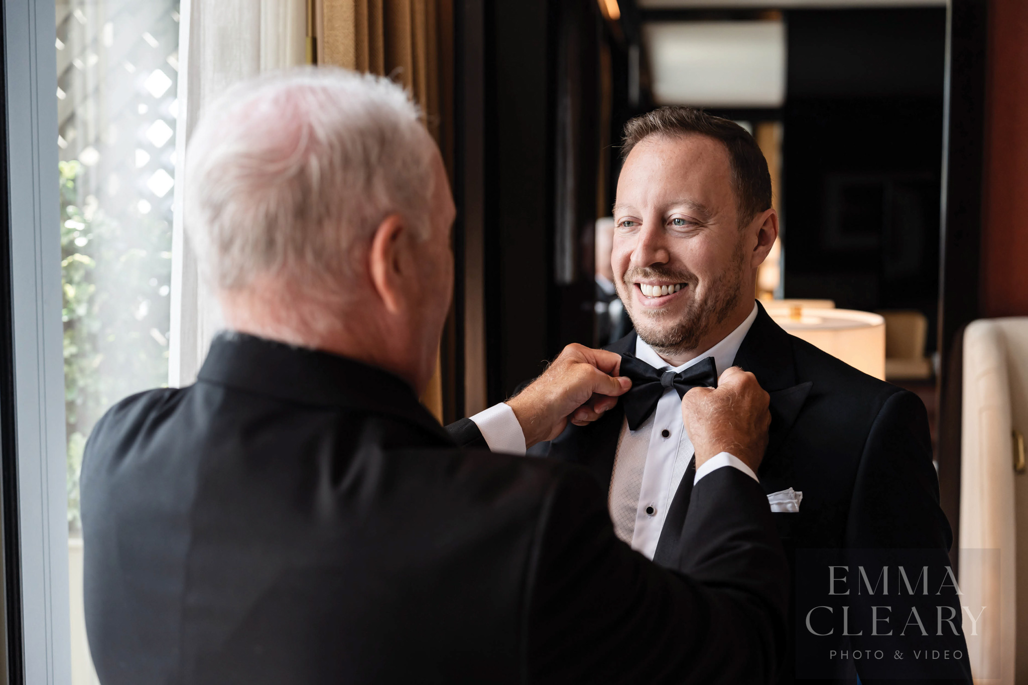 The father helps the groom