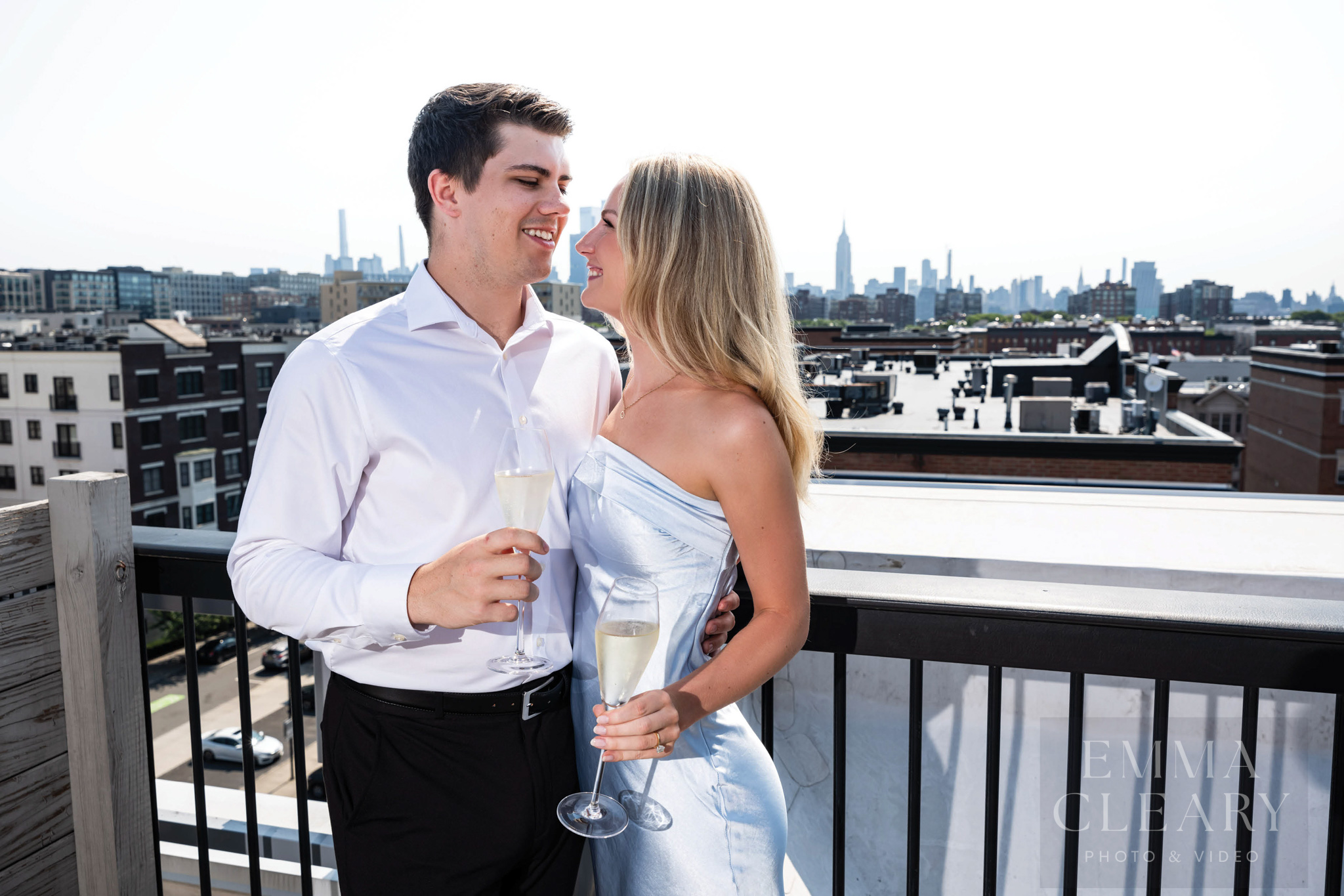 Engagement photo with a view of the city