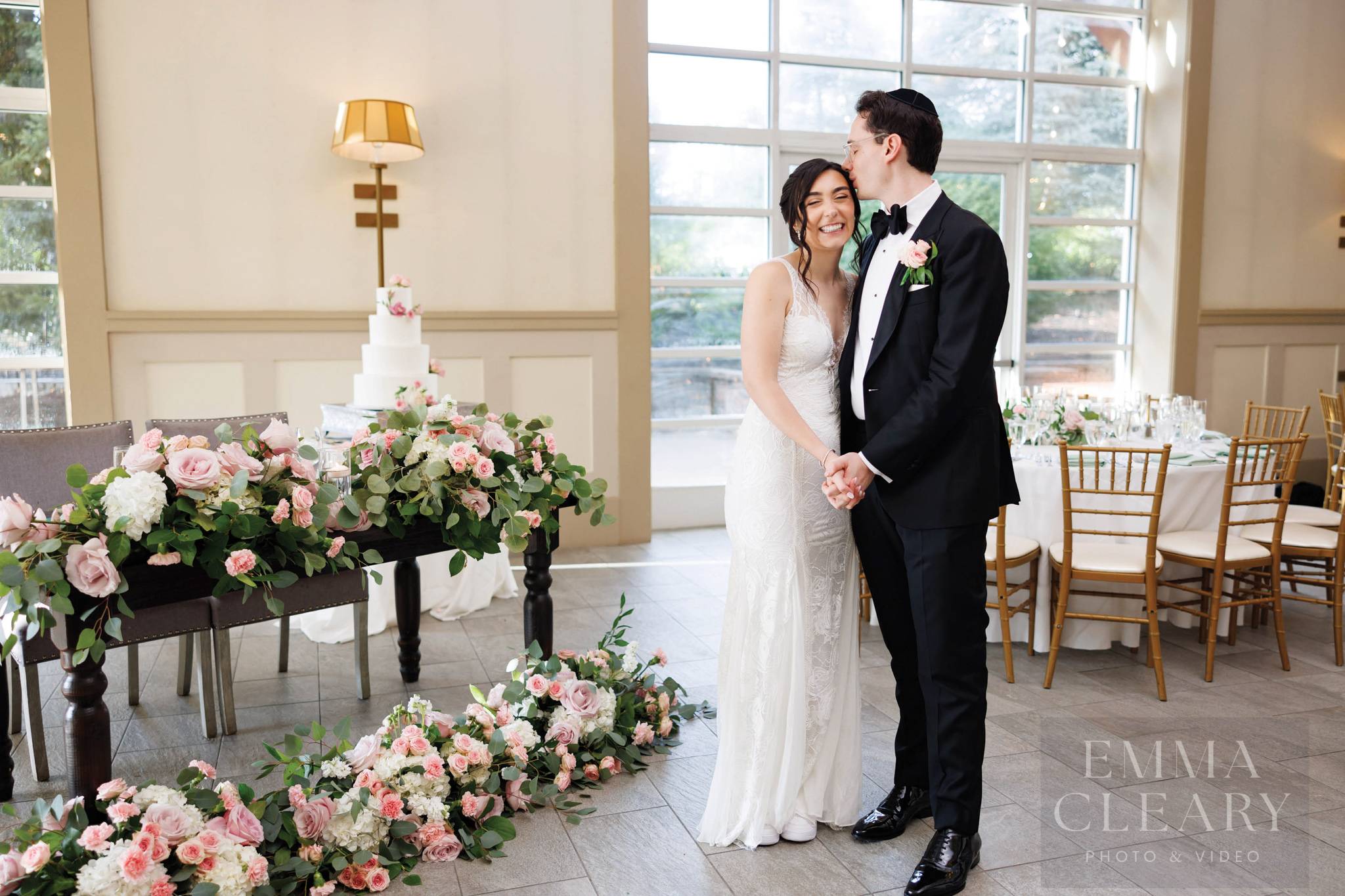 The groom kisses the bride