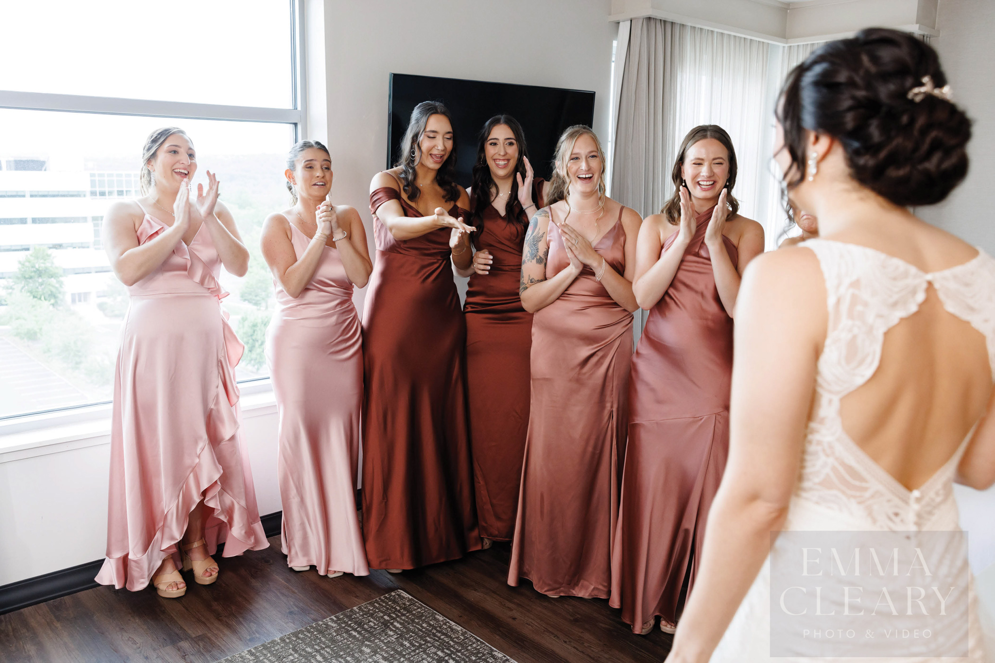 Bridesmades are surprised by the bride