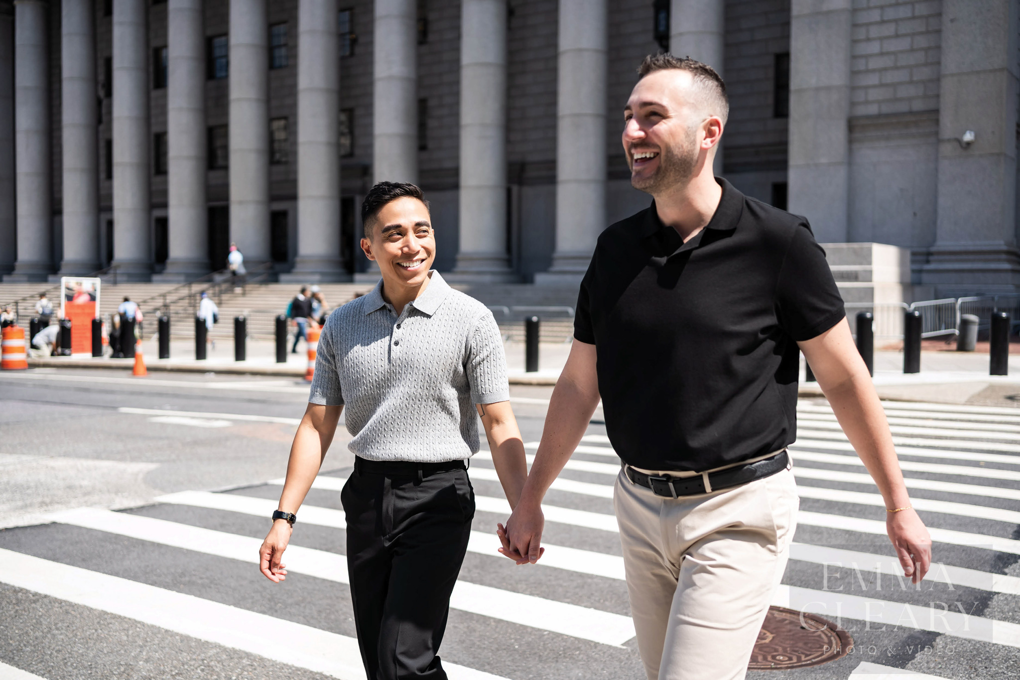 A wedding couple walks around the city