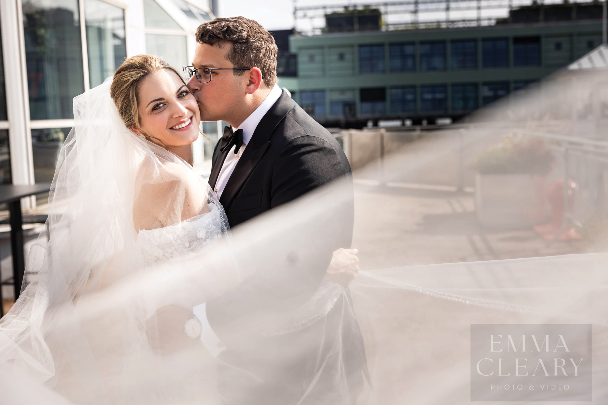 The groom kisses the bride