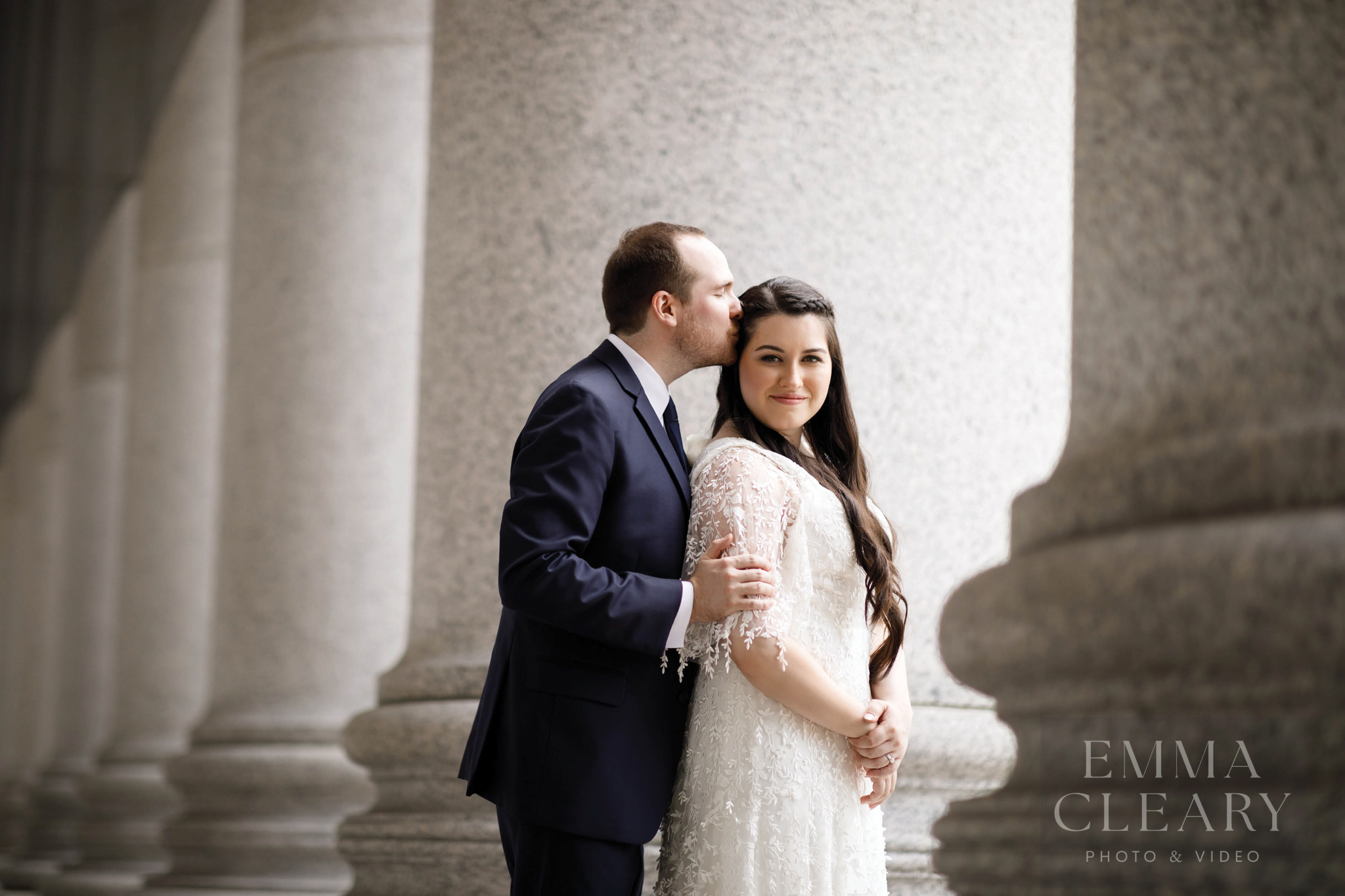 The groom kisses the bride