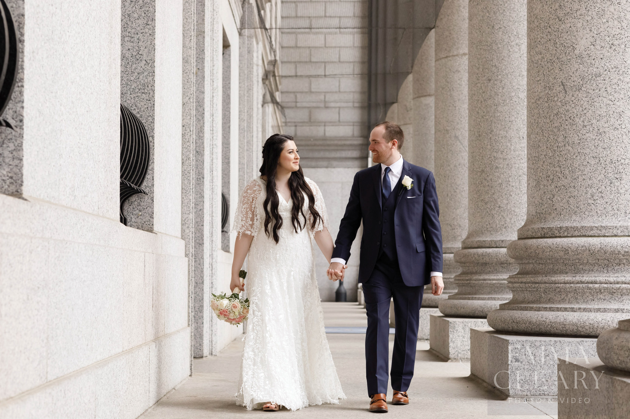 The bride and groom are walking