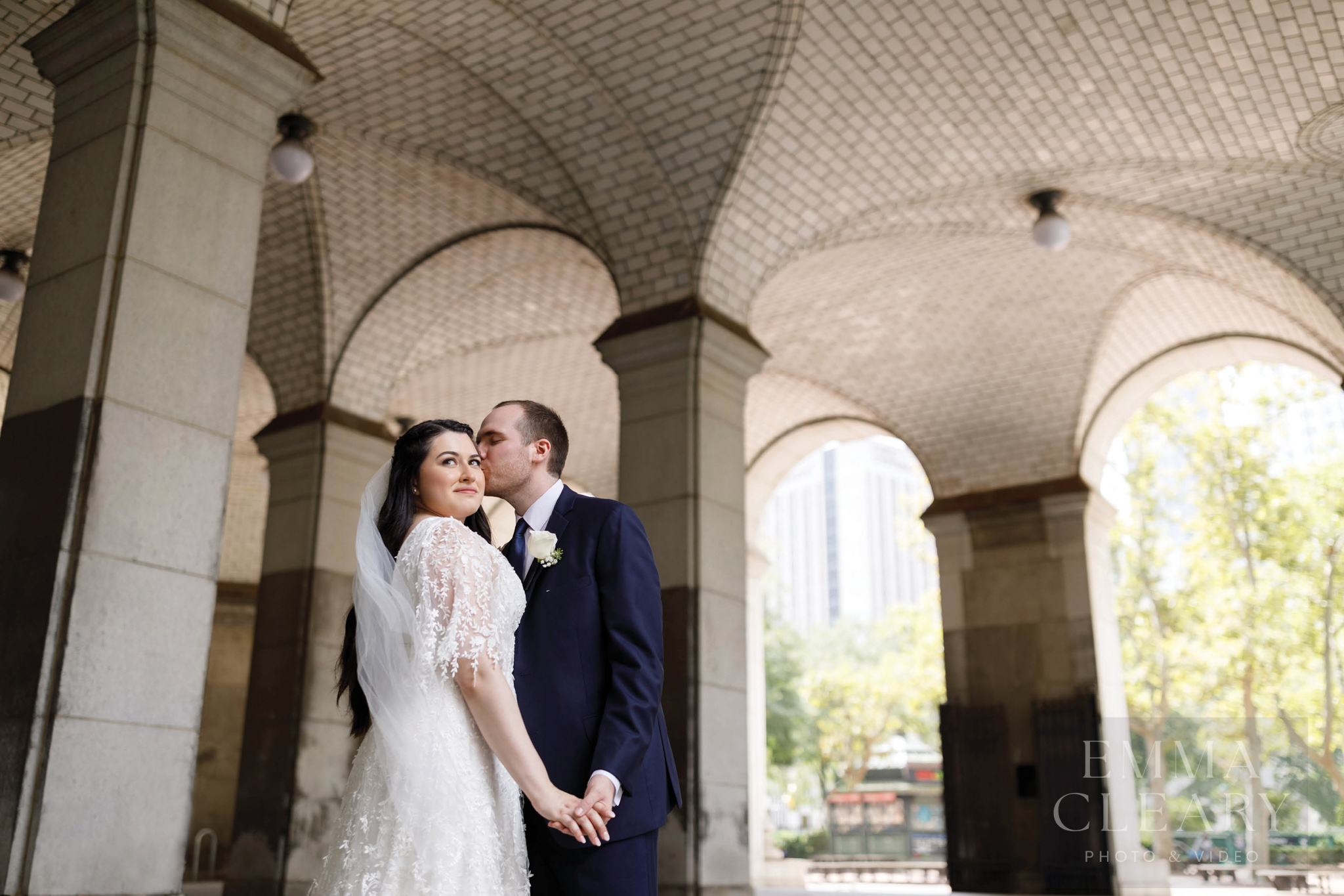 The groom kisses the bride