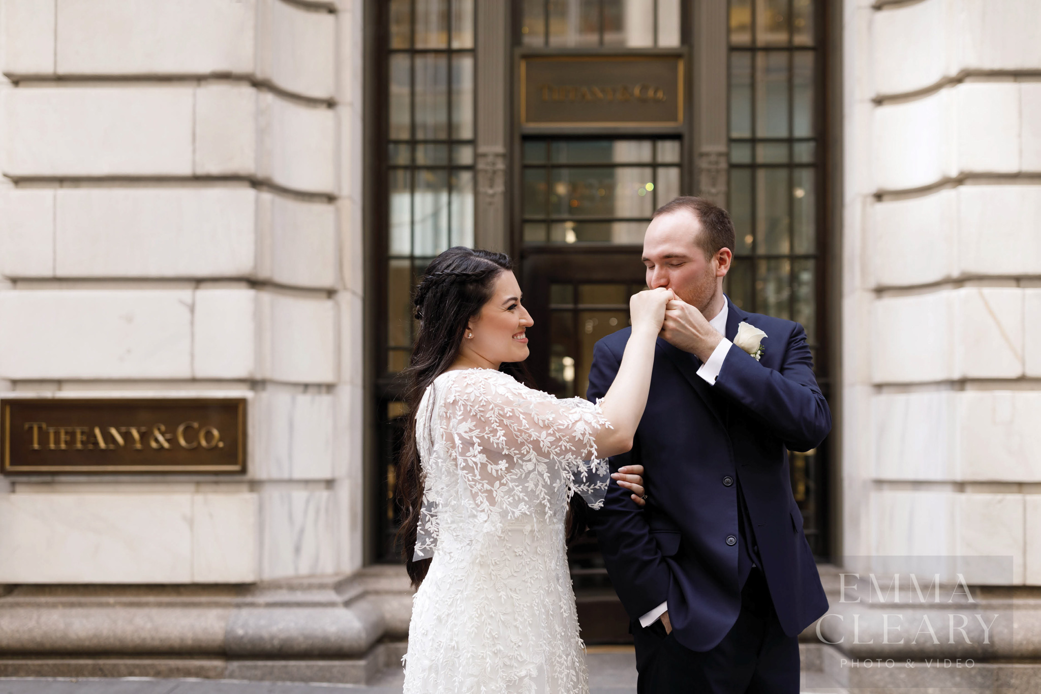 The groom kisses the bride