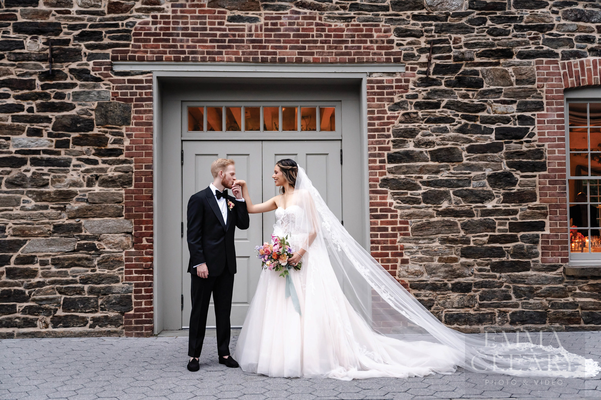 The groom kisses the bride's hand