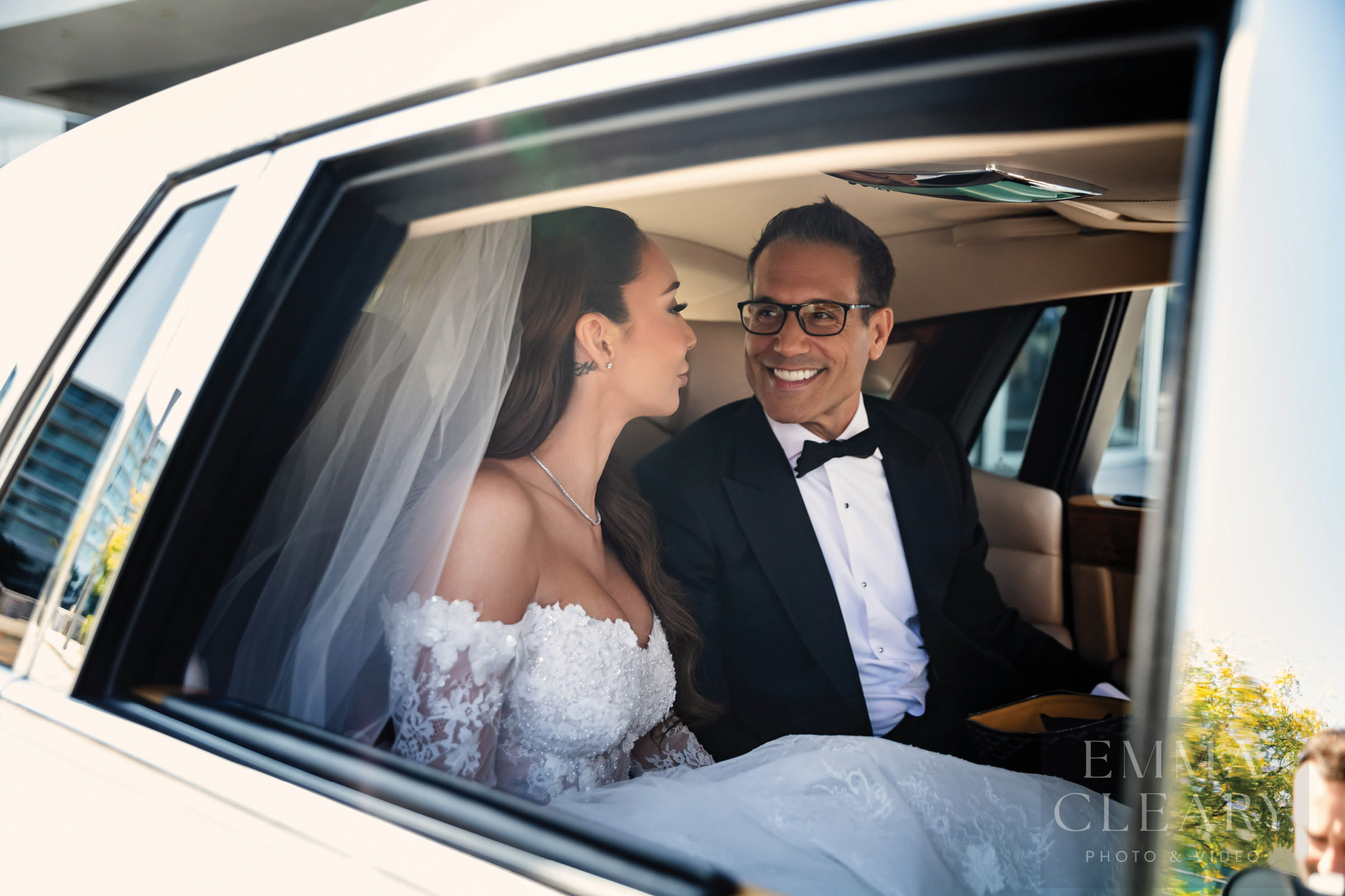 Photo of a couple in a wedding car