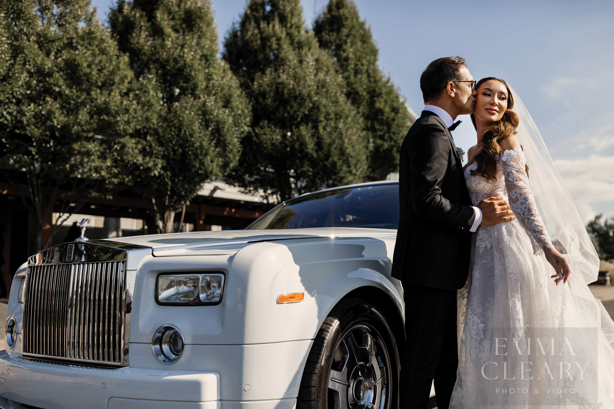 The groom kisses the bride